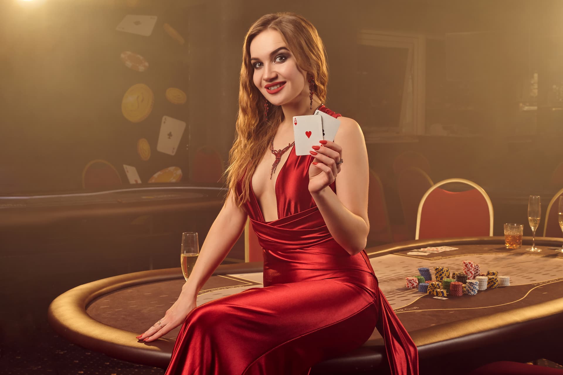 close-up-shot-of-a-wonderful-blond-girl-in-a-long-red-satin-dress-with-two-aces-in-her-hand-posing-sitting-on-a-poker-table-in-luxury-casino-passion-cards-chips-alcohol-win-gambling-it-is-a-f